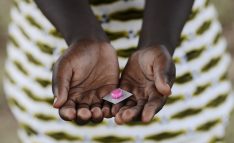 Black Girl Holding Pills Drugs to Cure Diseases in Africa